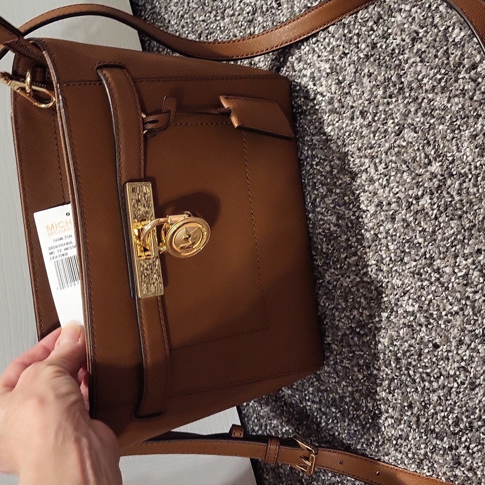 Michael Kors leather purse. Approximately 8 x 10.